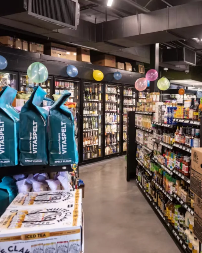 Inside a Savi market, looking down the beer and pantry aisle