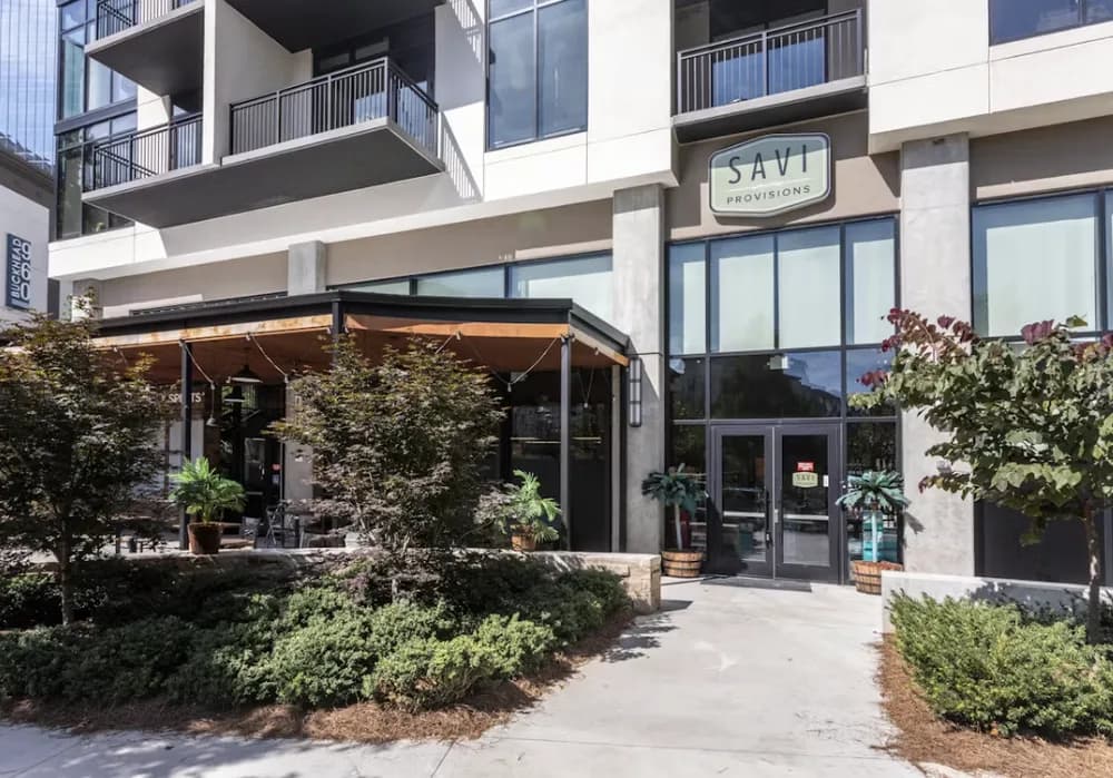A full-format Savi storefront on an urban street